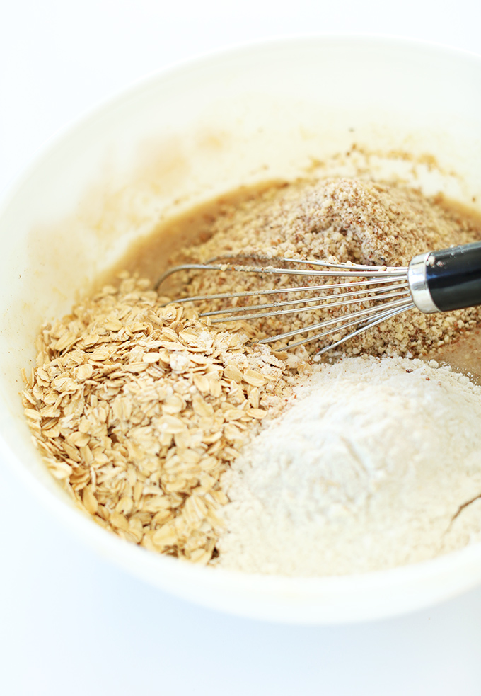 Stirring oats and flours into wet ingredients for our gluten free banana bread