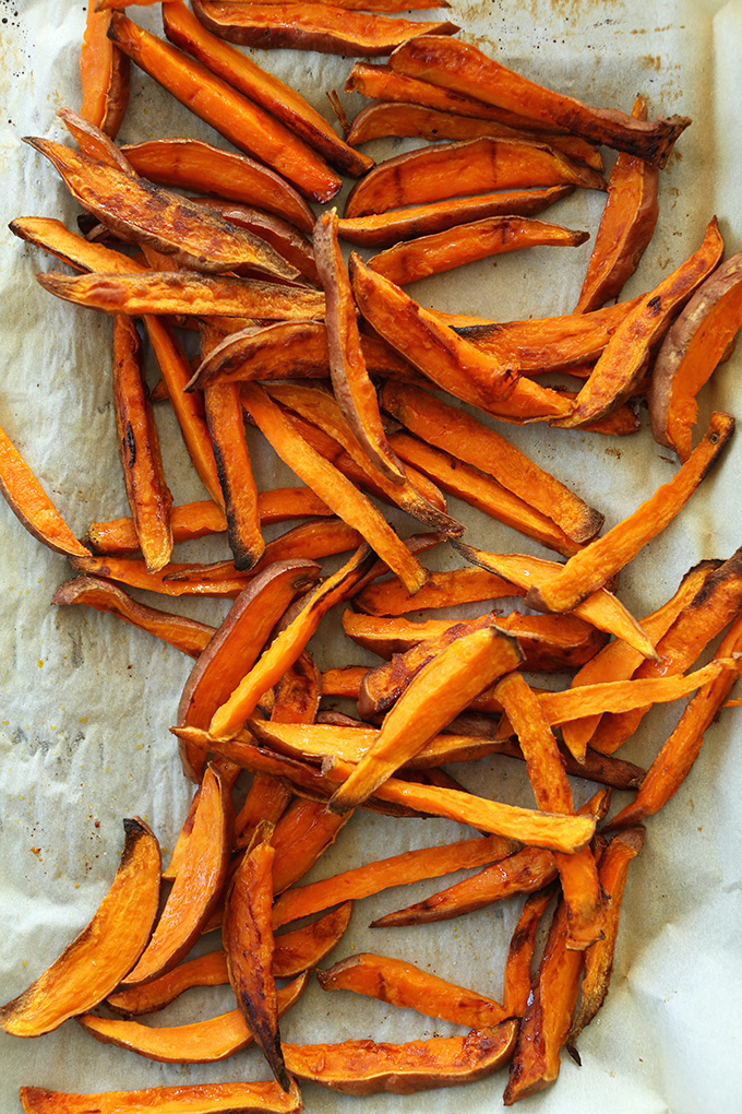Sweet Potato Fries on a parchment-lined baking sheet