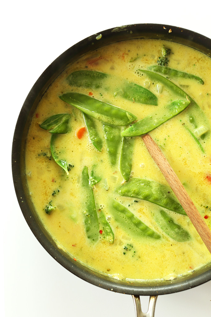 Saute pan filled with Easy Veggie Coconut Curry for a simple vegan dinner