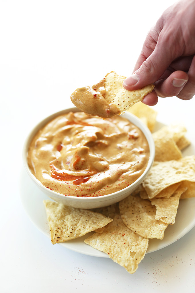 Chip with delicious Vegan Queso Dip made without gluten, soy, corn, or dairy