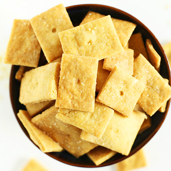 Top down shot of a bowl filled with homemade Vegan Cheez Its