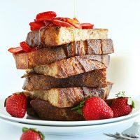 Plate piled high with slices of our Vegan French Toast Recipe