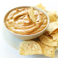 Tortilla chips and a bowl of homemade Vegan Queso made without cashews