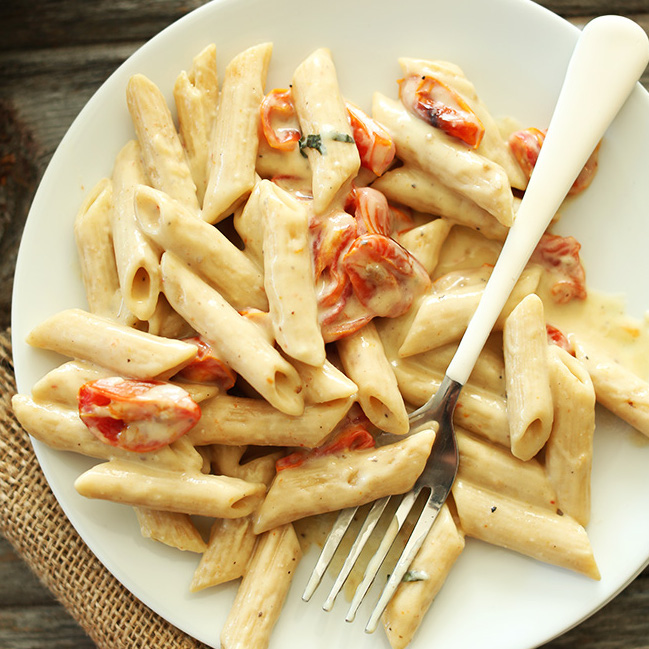 Plate of Creamy Vegan Garlic Pasta with Roasted Tomatoes
