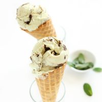 Waffle cones filled with homemade Creamy Vegan Mint Brownie Ice Cream