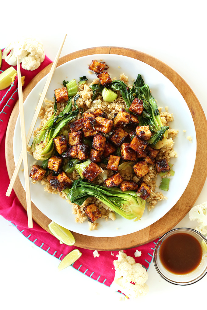 Easy Crispy Tofu in a 5-ingredient peanut glaze that's AMAZING. Serve over cauliflower rice for a healthy vegan gf dinner!