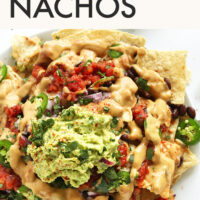 Plate of vegan nachos with guacamole on top