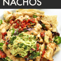 Plate of vegan nachos with guacamole on top