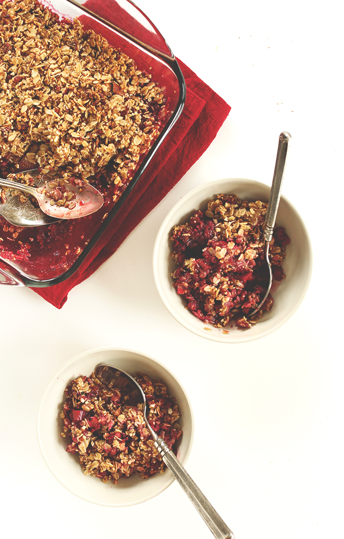 Baking dish and bowls of our Simple Rhubarb Raspberry Crisp