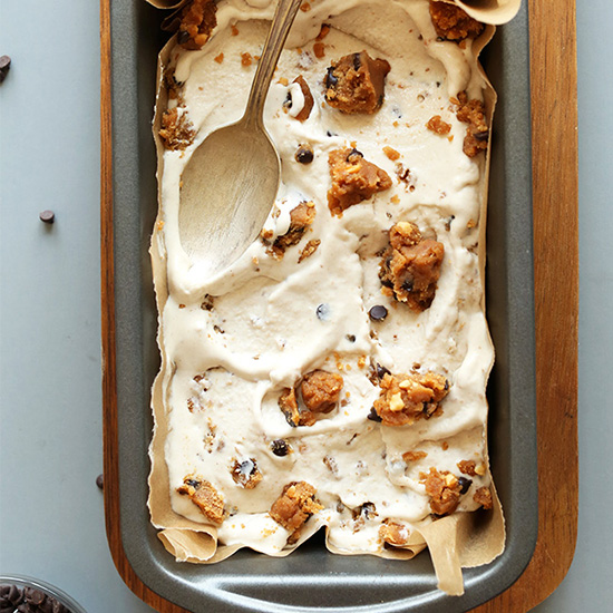 Spoon in a baking pan of Vegan Peanut Butter Chocolate Chip Cookie Dough Ice Cream