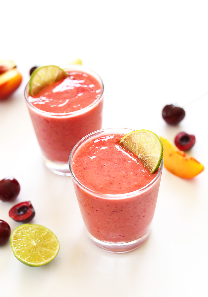 Two glasses of vibrant pink Cherry Limeade Smoothies