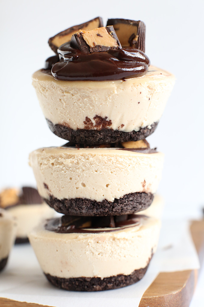 Stack of Vegan Peanut Butter Cup Cheesecakes topped with mini peanut butter cups