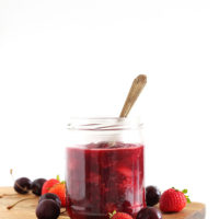 Jar of simple fruit compote made with fresh fruit and orange juice