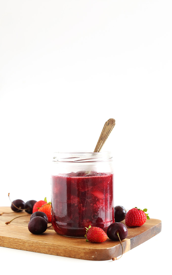 Jar of homemade Simple Fruit Compote for topping pancakes and other vegan breakfasts