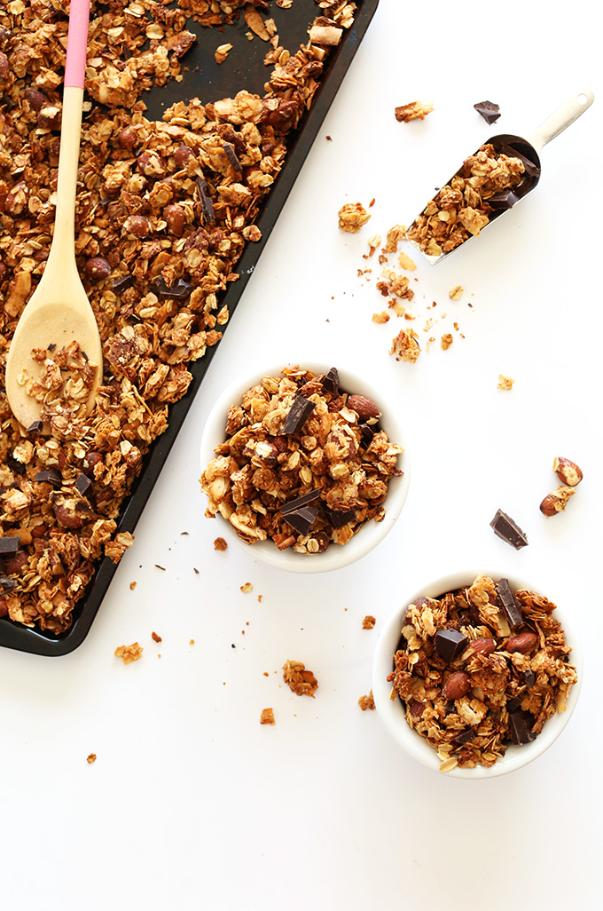 Bowls and tray filled with a batch of our gluten-free vegan Almond Joy Granola recipe