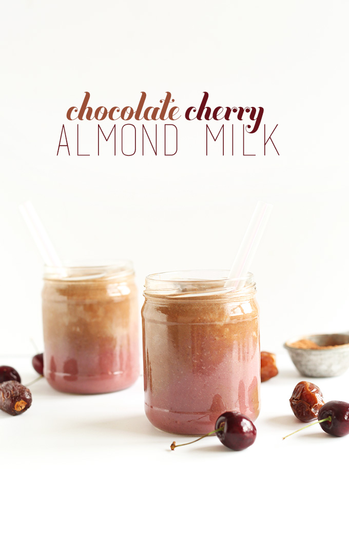Beautifully layered jars of Chocolate Cherry Almond Milk for a creamy delicious vegan drink