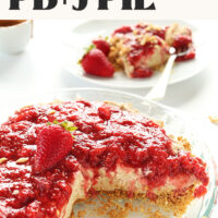 Plate with a slice of pie behind a pie pan of pb&j pie with text that reads vegan no-bake pb&j pie just 9 ingredients