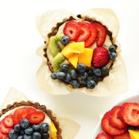 No-Bake Lemon Cookie Fruit Tarts in parchment-lined mini tart tins