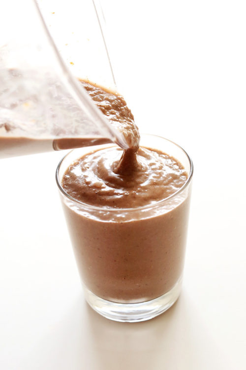 Pouring Chocolate Coconut Chia Smoothie into a glass