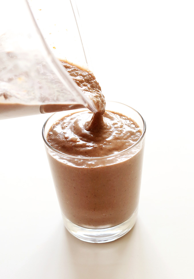 Pouring Chocolate Coconut Chia Smoothie into a glass
