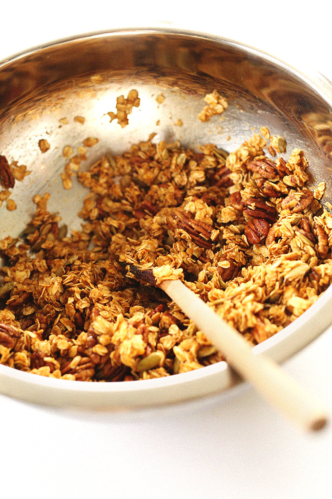 Stirring together ingredients for our healthy Pumpkin Pecan Granola recipe