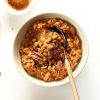 Bowl of Sweet Potato Pie Oats topped with pecans