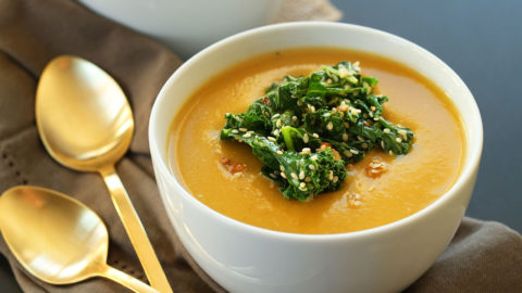 Bowls of Pumpkin Soup with Sesame Kale topping