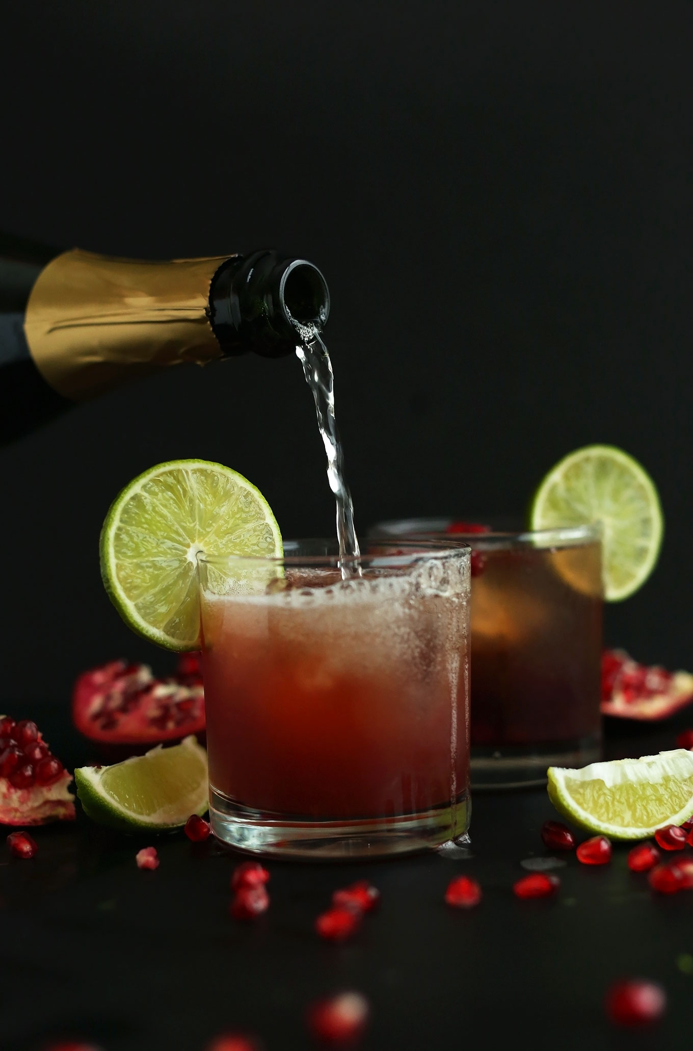 Adding champagne to make a New Year's Eve Sparkling Pomegranate Margarita