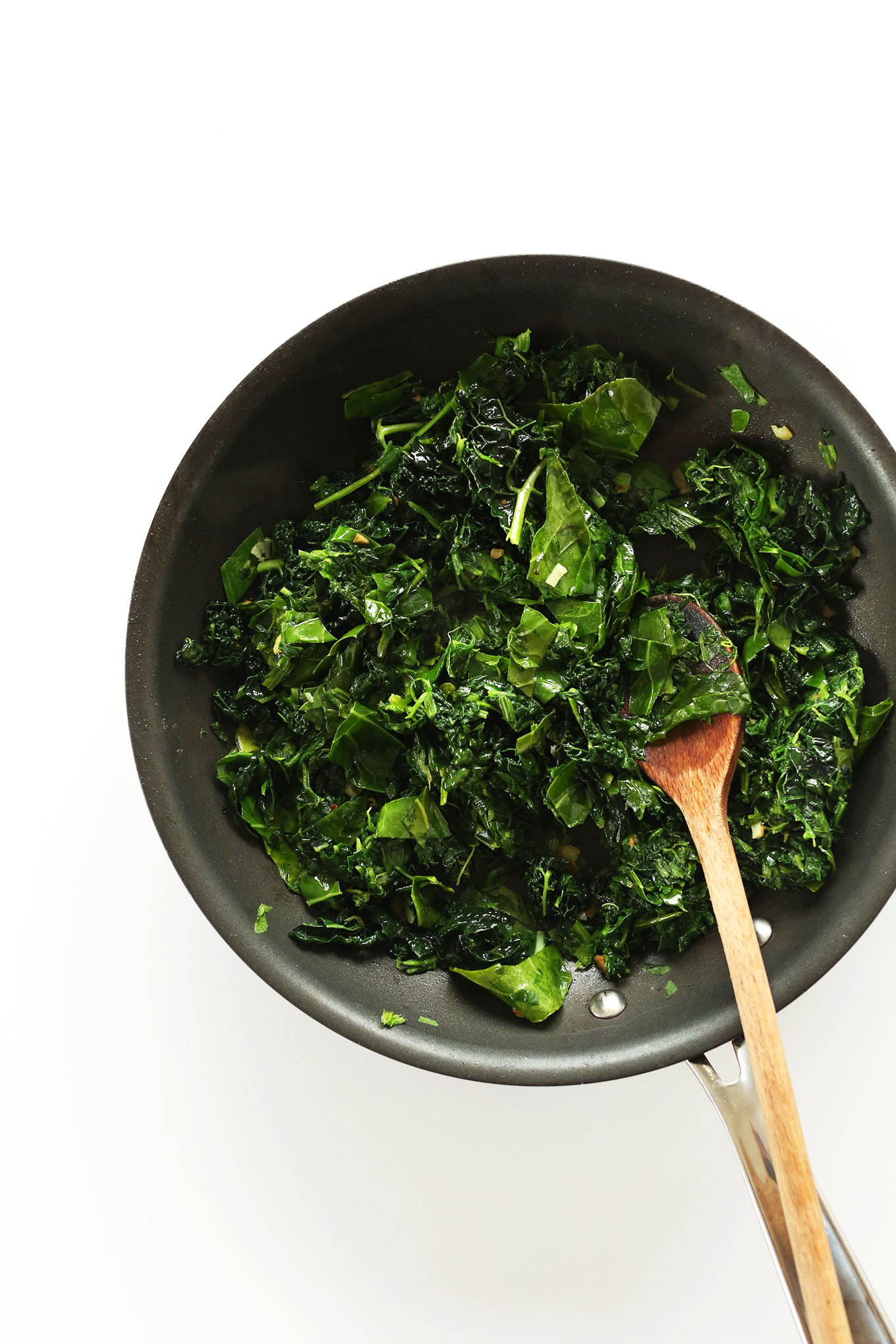 Cooking kale and spinach for a healthy gluten-free vegan appetizer