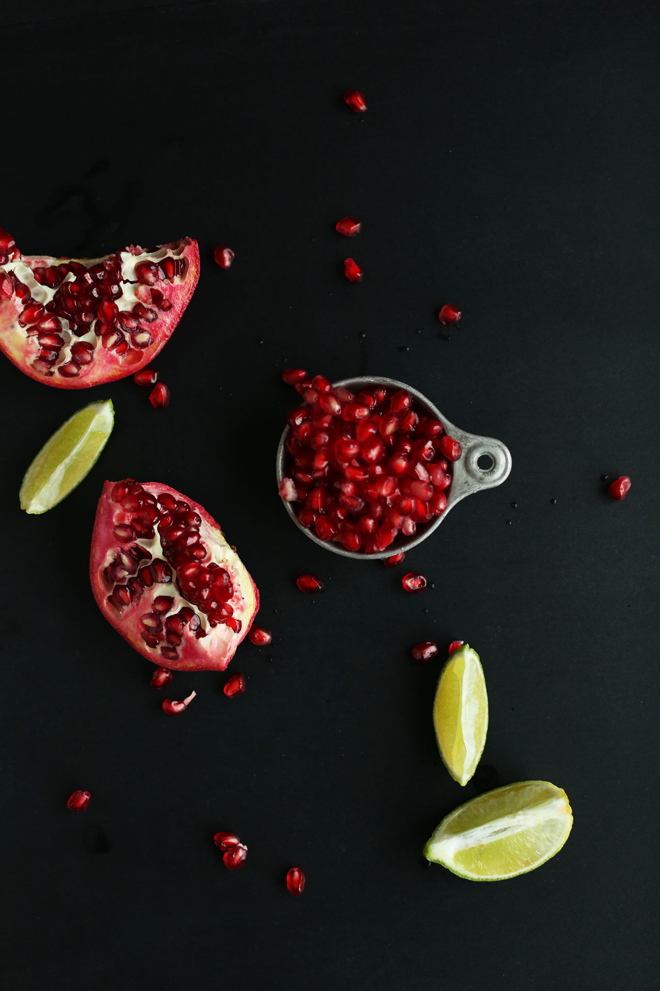 Pomegranate and limes for making vegan New Year's drinks