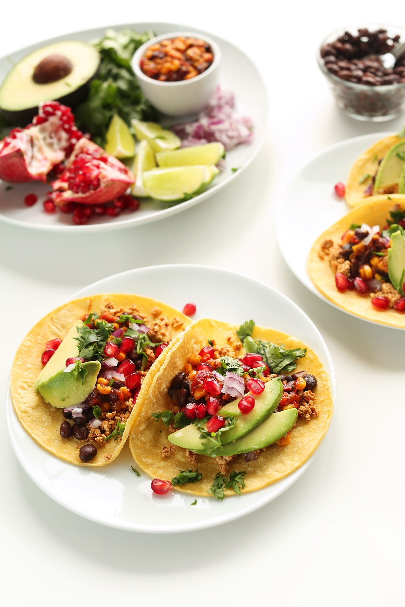 Plates of easy vegan breakfast tacos made with fresh fruit and veggies
