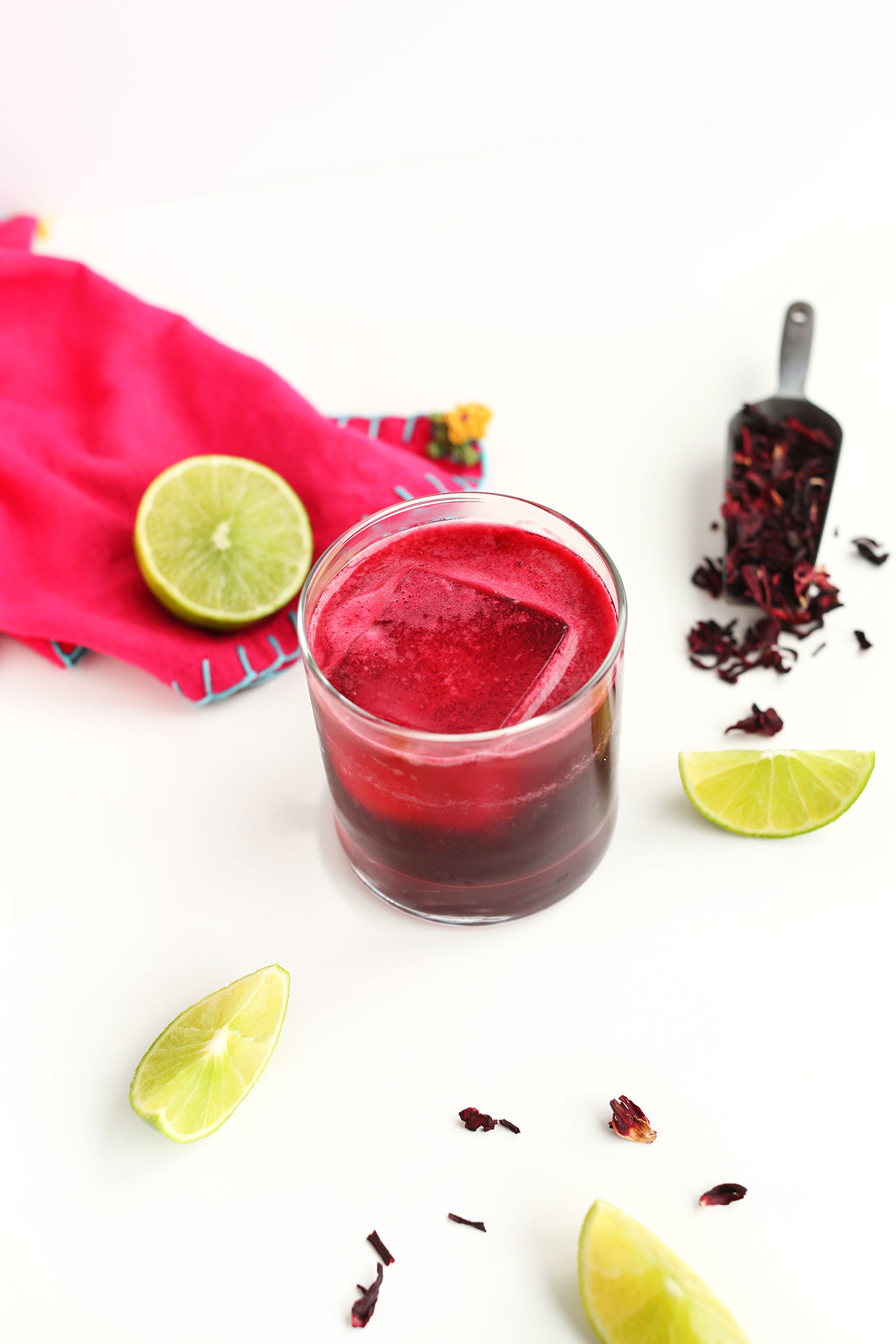 Glass of our incredible homemade Hibiscus Margarita recipe with lime
