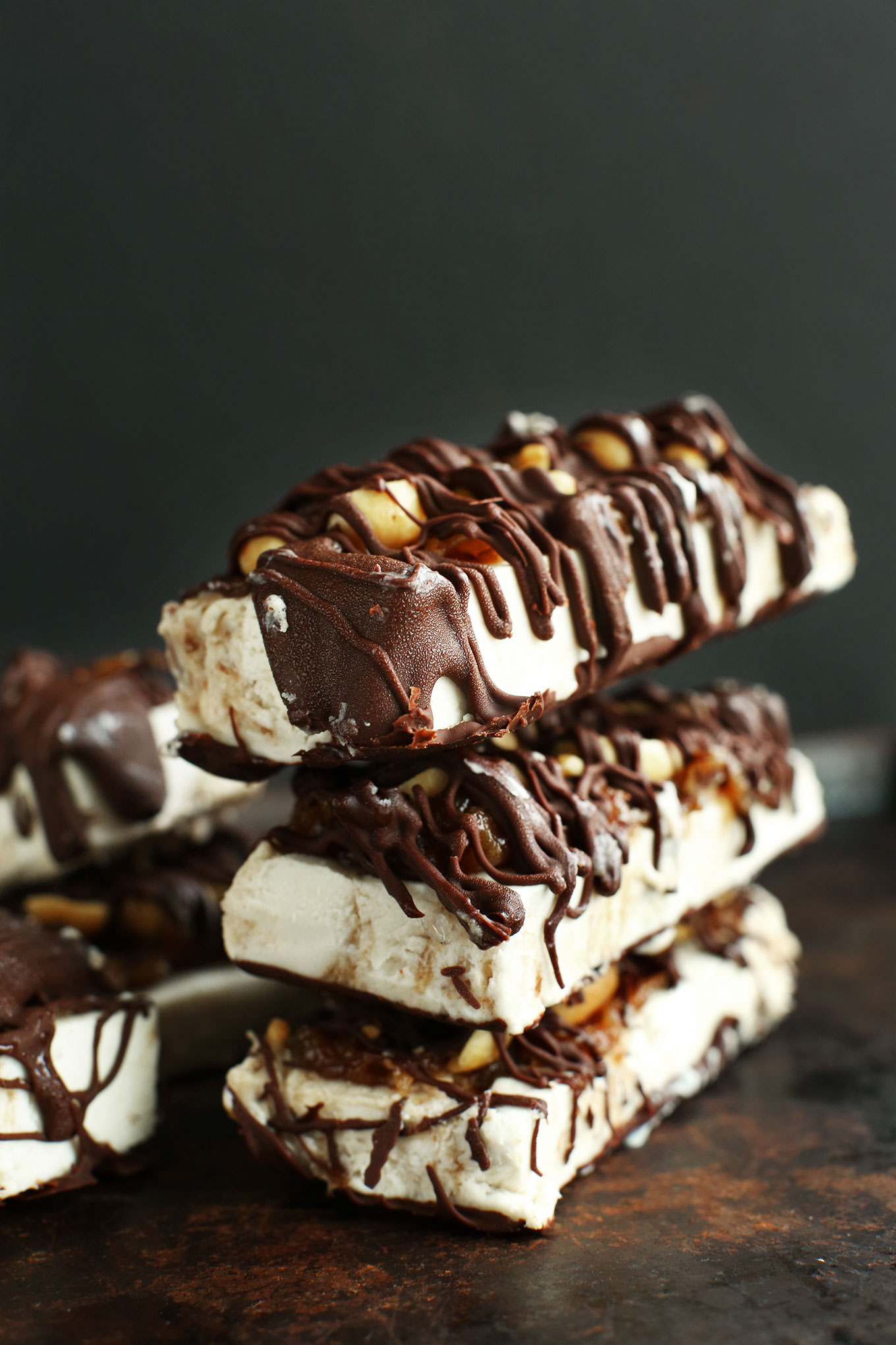 Stack of gluten-free Vegan Ice Cream Snickers Bars for an amazing summer dessert