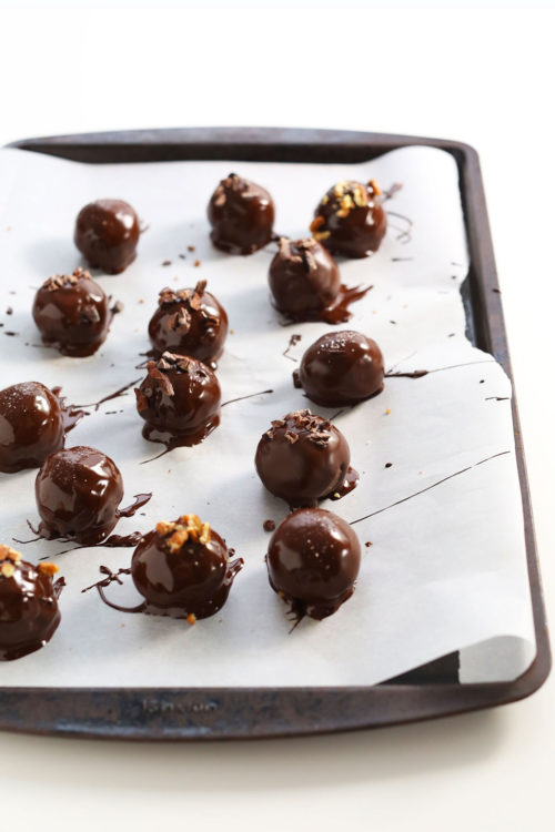 Vegan Chocolate Truffles on a parchment-lined baking sheet