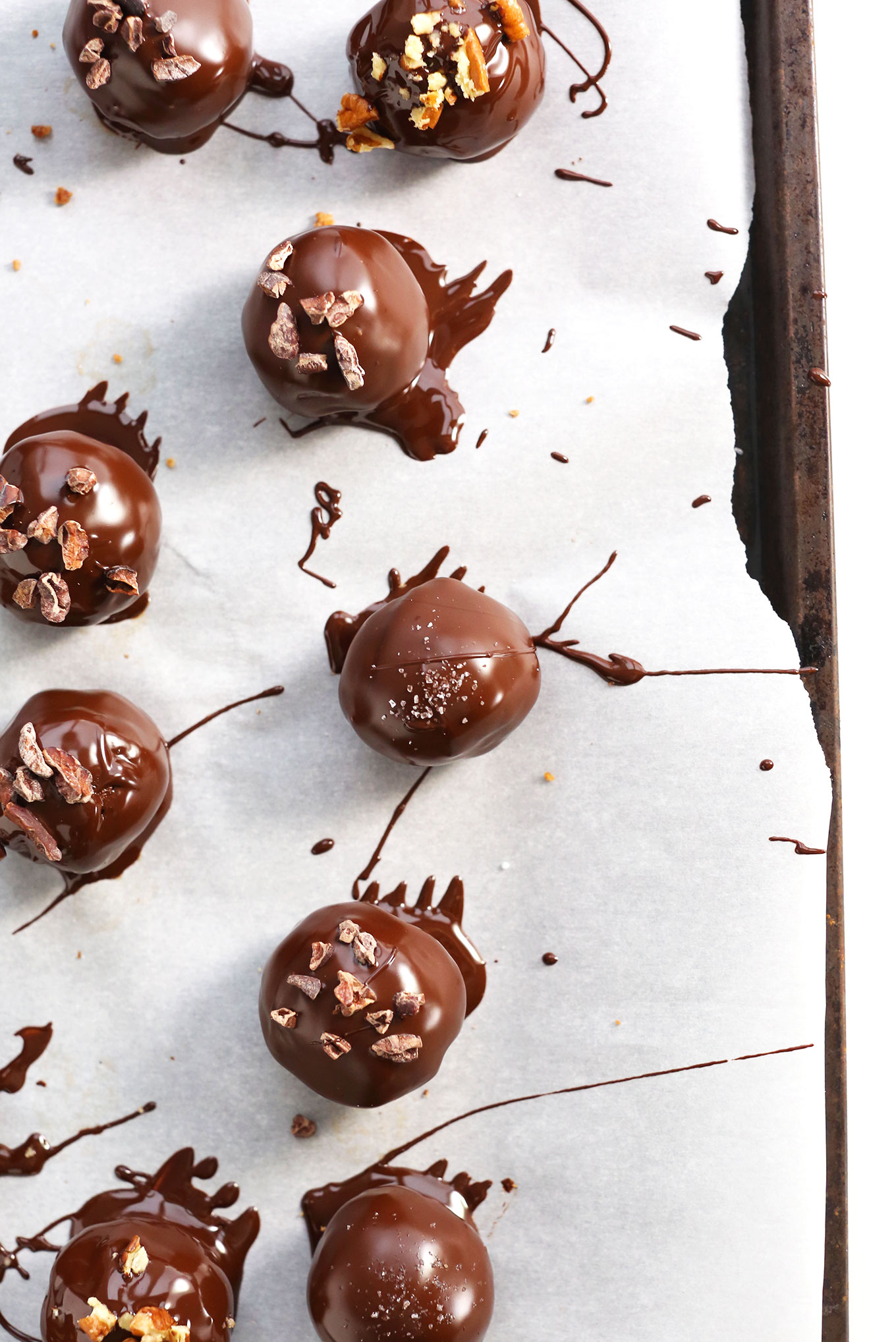 Parchment-lined baking sheet with our healthy Chocolate Vegan Truffles recipe