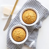 Two Vegan Cornbread Muffins in ramekins to be served with chili