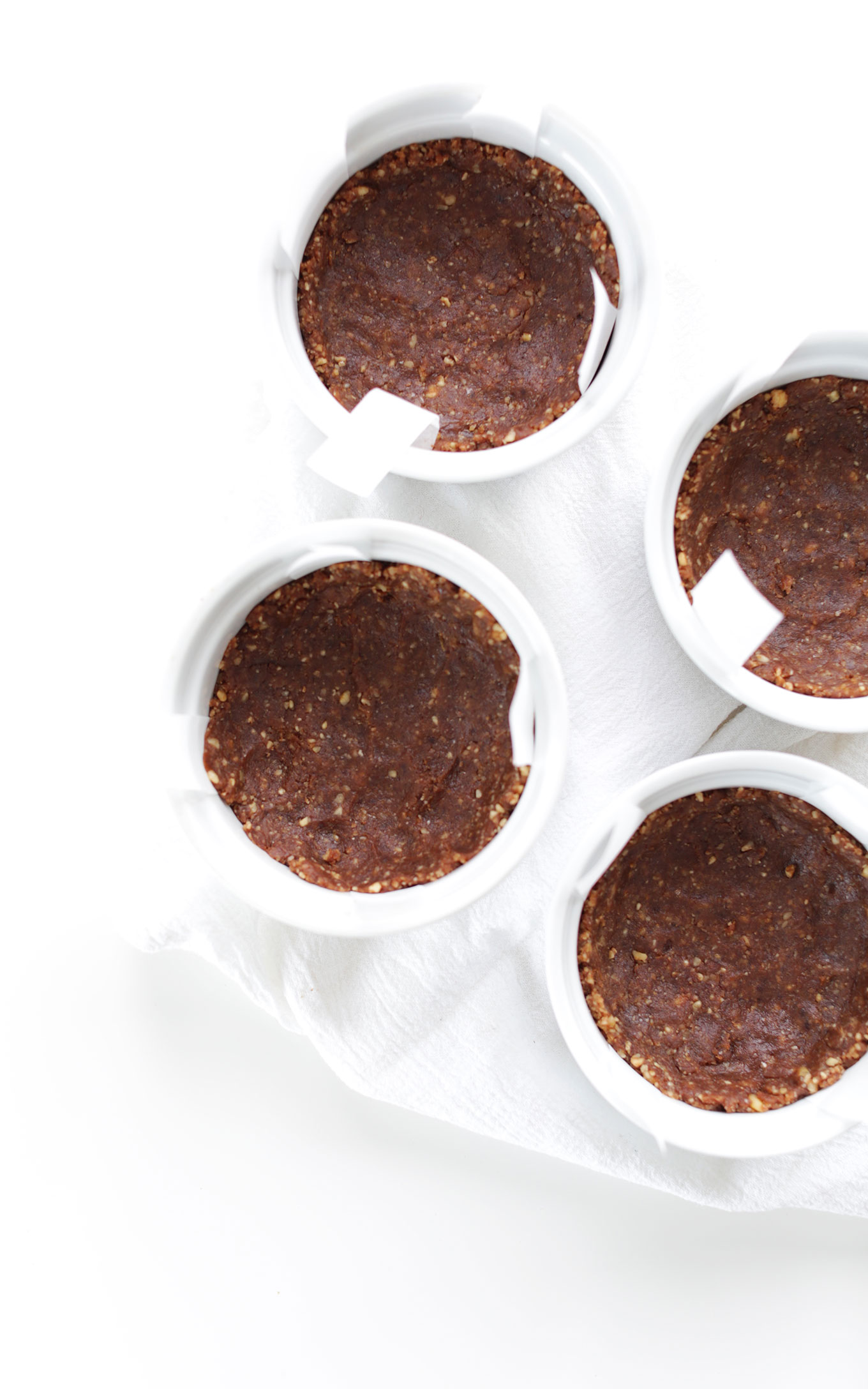 Ramekins filled with gluten-free vegan Chocolate Date Walnut Crust
