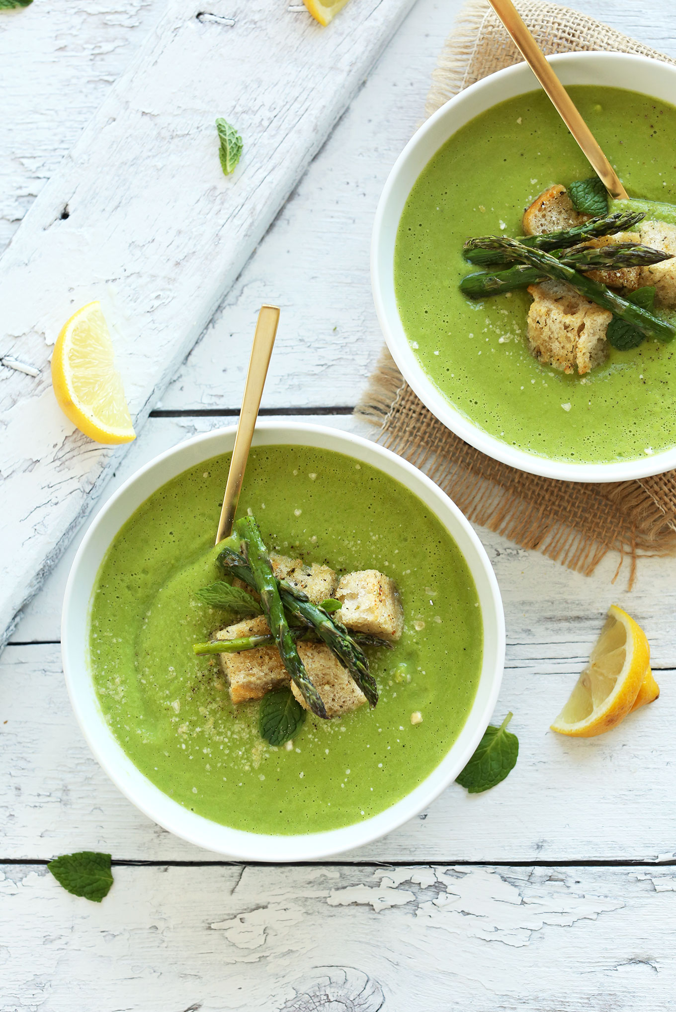 Bowls of homemade Creamy Asparagus and Pea Soup for a quick and healthy vegan dinner