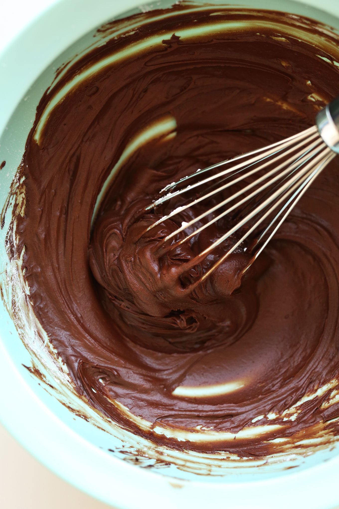 Making easy butter-free Vegan Chocolate Ganache Frosting in a mixing bowl
