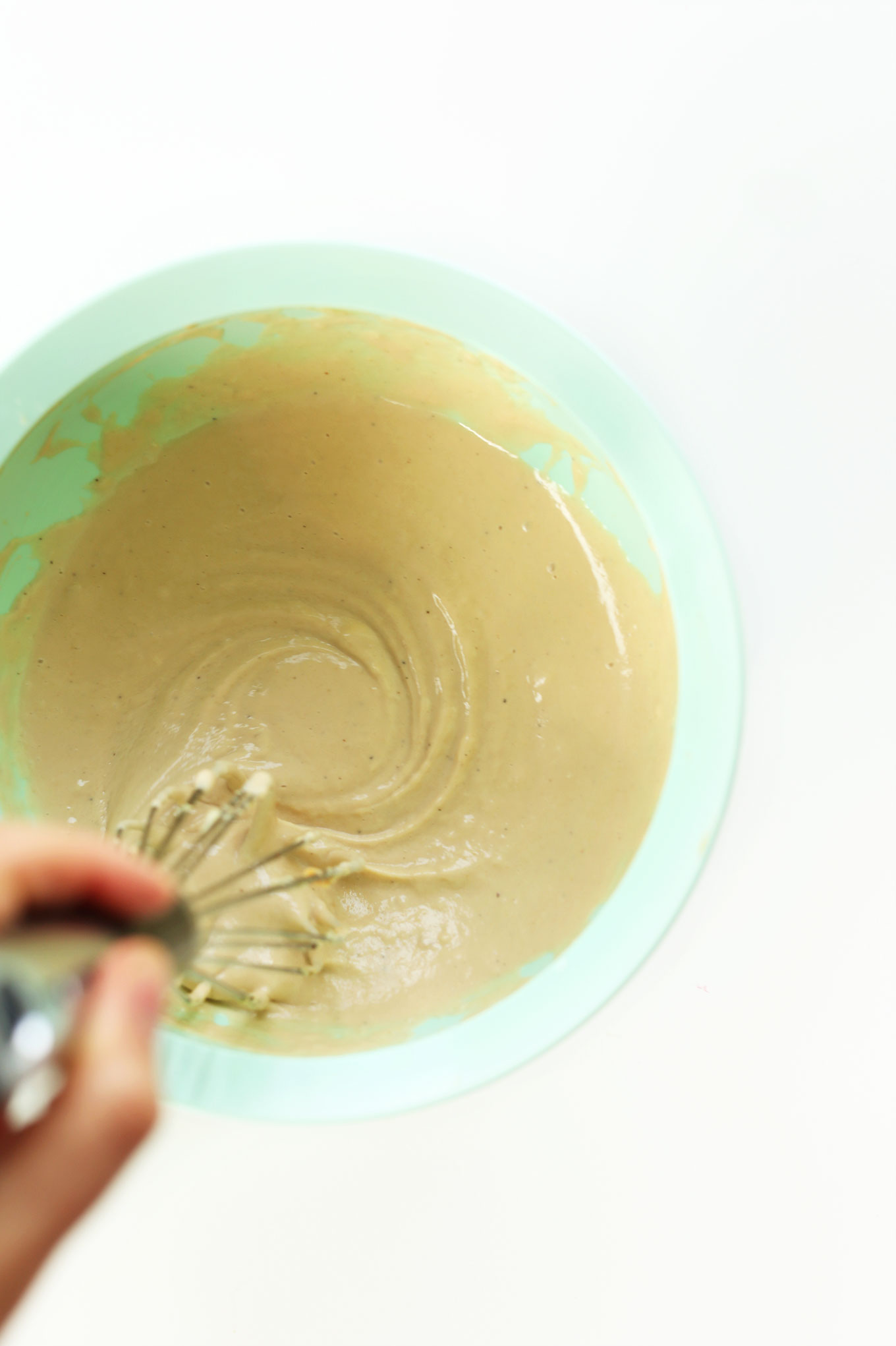 Whisking together our Maple Tahini Dressing recipe