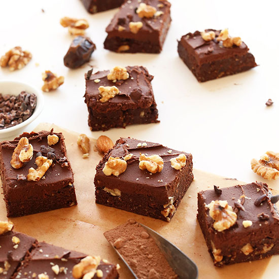 Batch of Raw Vegan Brownies cut into squares and topped with walnuts