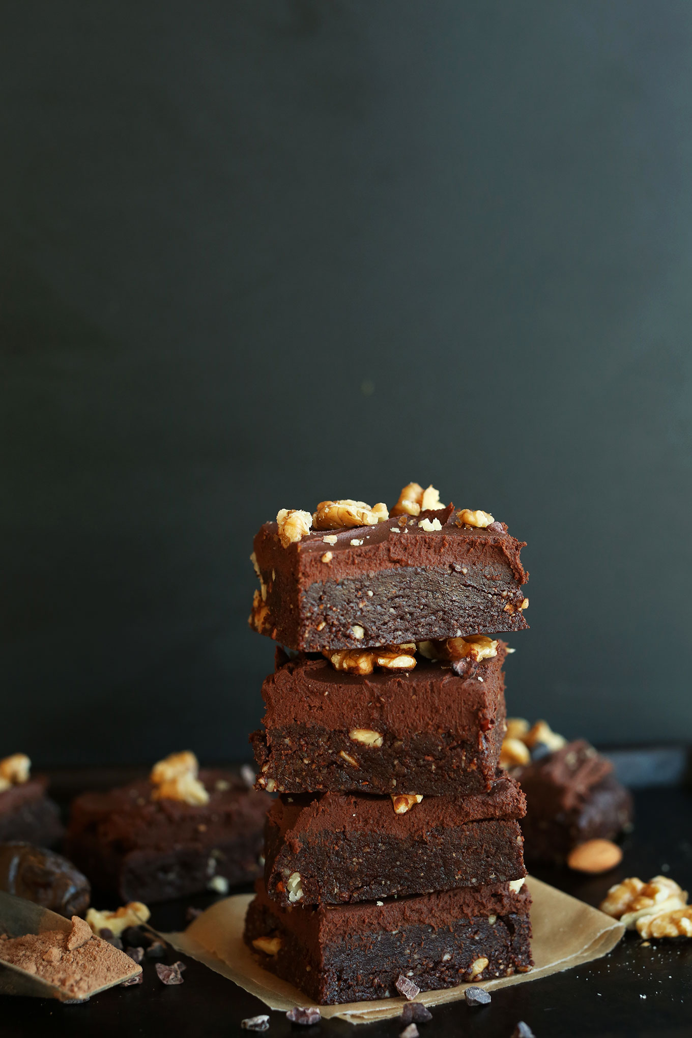 Stack of the BEST Raw gluten-free Vegan Brownies topped with Chocolate Ganache Frosting