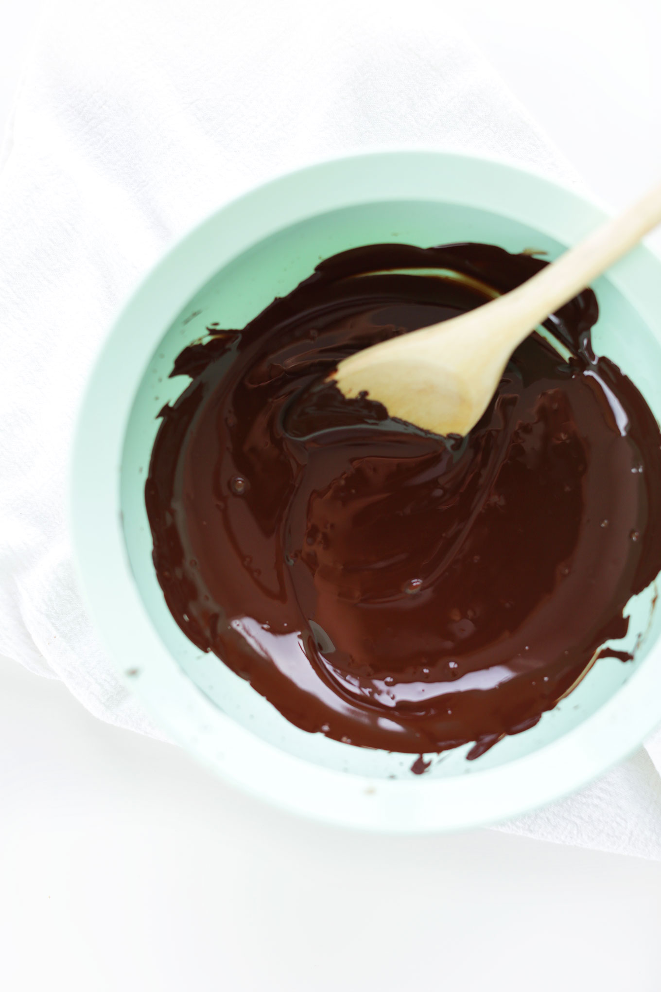 Big bowl of melted dark chocolate for making homemade Vegan Chocolate Cheesecakes