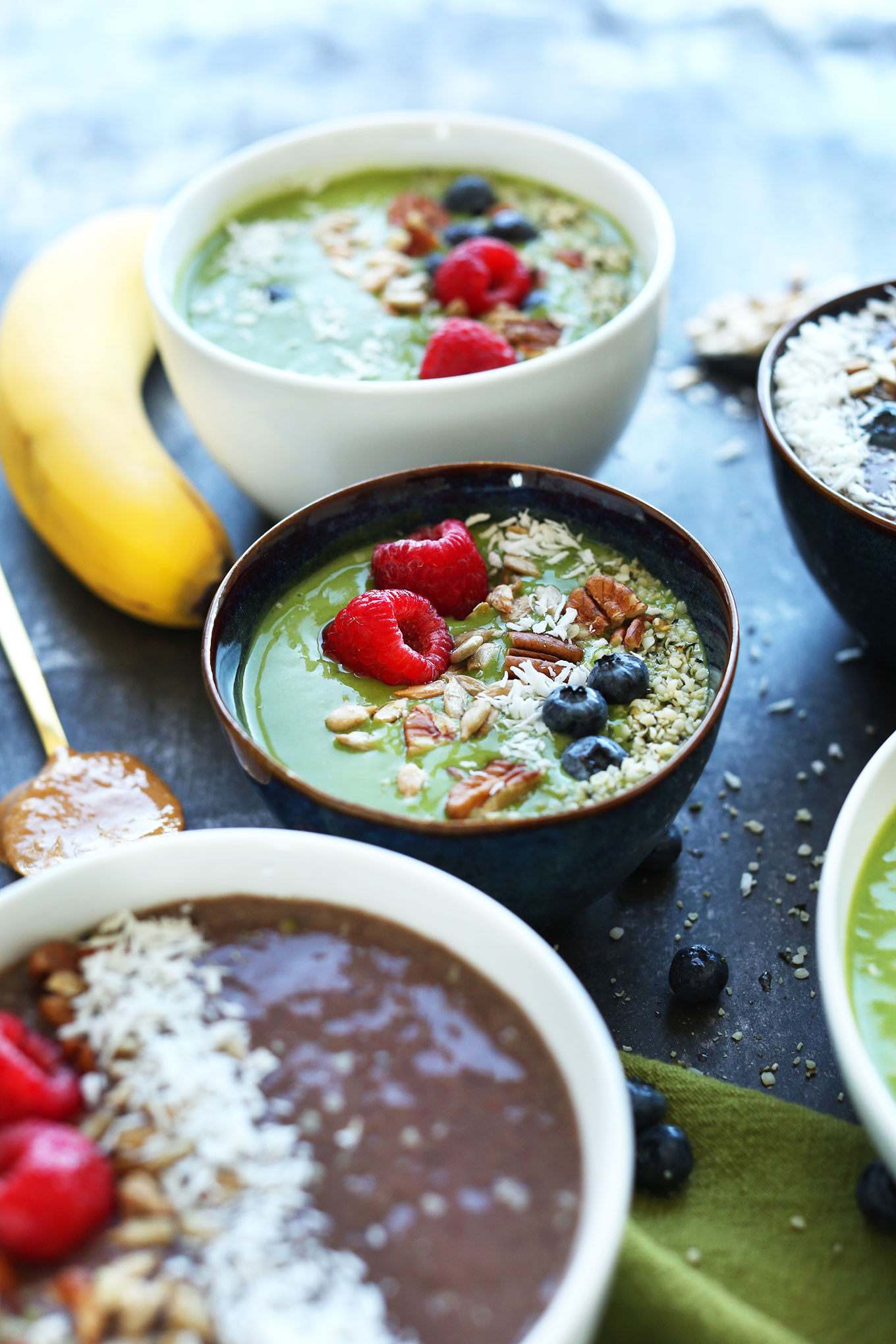 Bowls of vegan Green Smoothie Bowls topped with gluten-free goodness