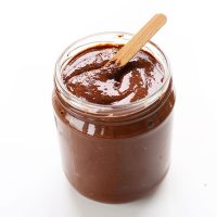 Wooden stick in a jar of homemade Vegan Nutella