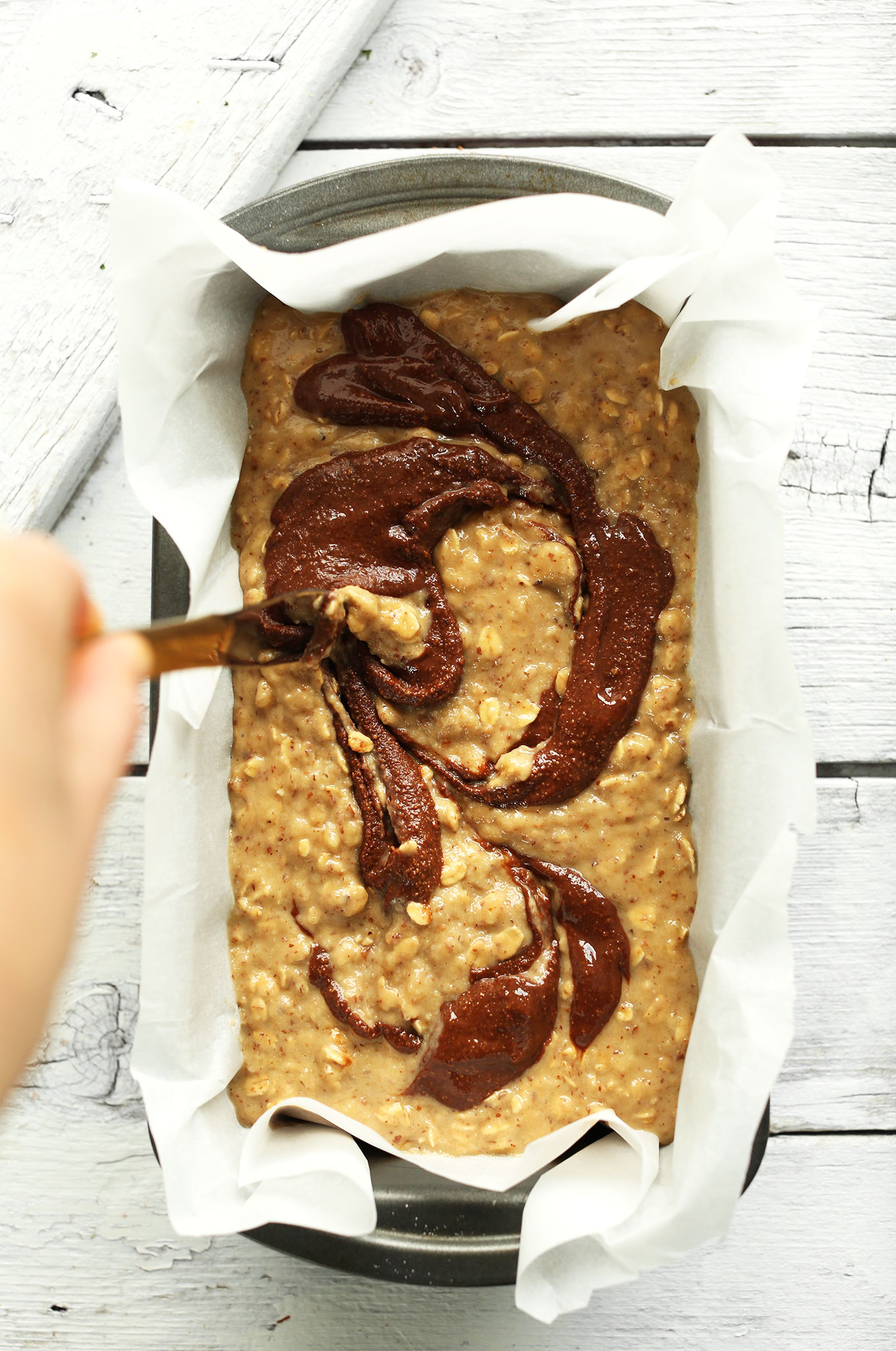 Using a knife to create a Nutella swirl in our Nutella Banana Bread recipe