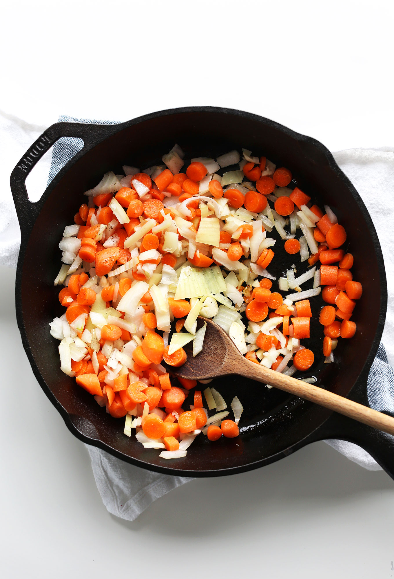 Sautéing onions and carrots for our Spicy Chipotle Red Salsa recipe