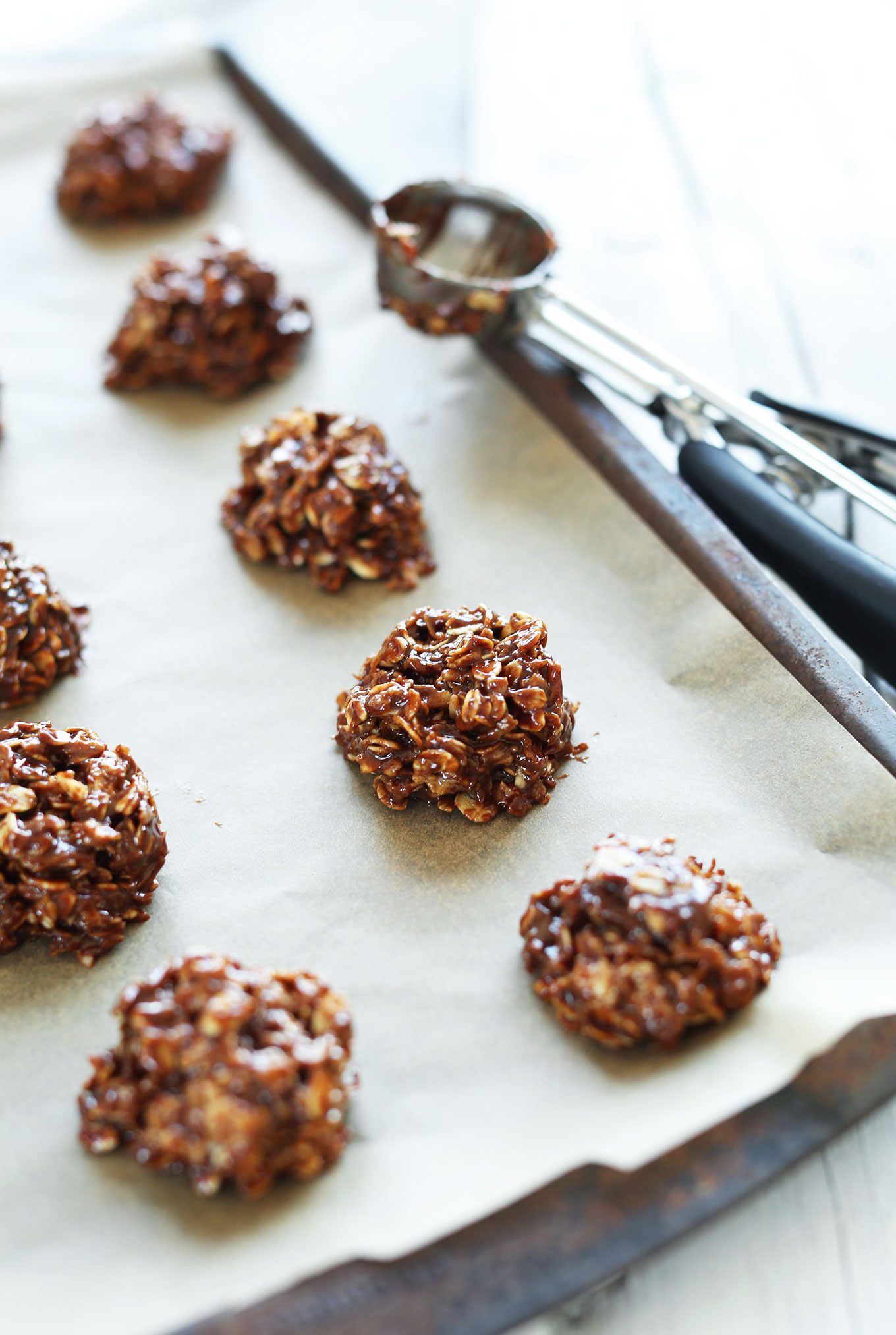 Gluten-free Vegan Coconut No-Bake Cookies on a parchment-lined pan