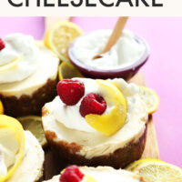Vegan and gluten-free white chocolate lemon cheesecakes on a cutting board