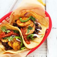 Basket filled with Spicy Plantain Black Bean Tacos